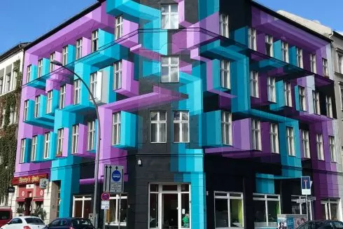 Фото дня: вуличний художник оживляє фасади тривимірними зображеннями